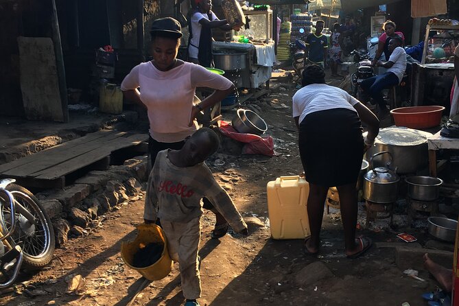 Half day Kampala City Motor Bike Tours - Owino Market, where Kampala gets practical