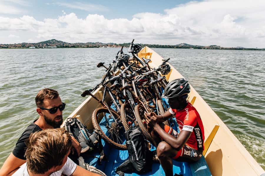 Kampala: Lake Victoria Island Cycling Tour - Stopping at a trading center for a local snack